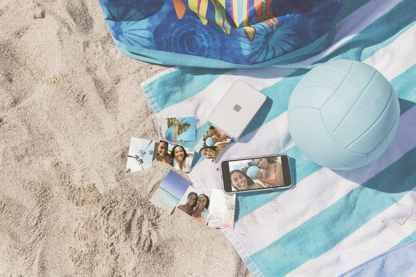 Lifeprint printer and photos on beach scene